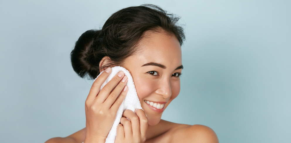 towel on asian woman's face