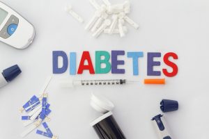diabetes word surrounded by test kits