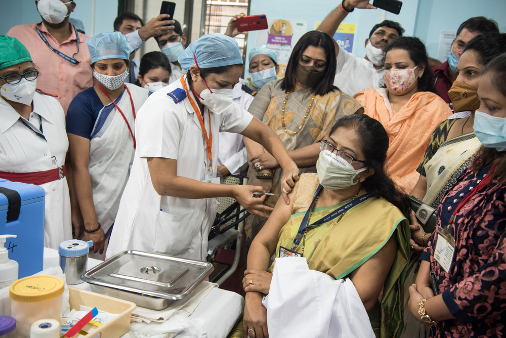 india covid-19 vaccination crowd women