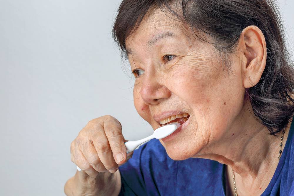 Asian,Elderly,Woman,With,A,Toothbrush.,Dental,Health