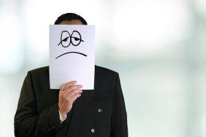 Business,Concept,Image,Of,A,Businessman,Holding,White,Paper,Mask