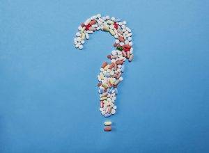 Medicine,Pills,Is,Like,Question,Mark,On,The,Blue,Background.