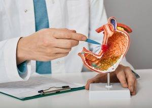 Gastroenterologist,Consultation,,Treatment,Of,Stomach,Diseases,And,Ulcers.,Doctor,Pointing
