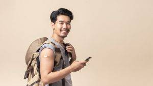 Portrait,Asian,Man,Backpacker,Smiling,Use,Smartphone,After,Getting,A