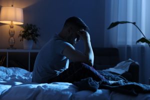 man suffering from sleep disorder